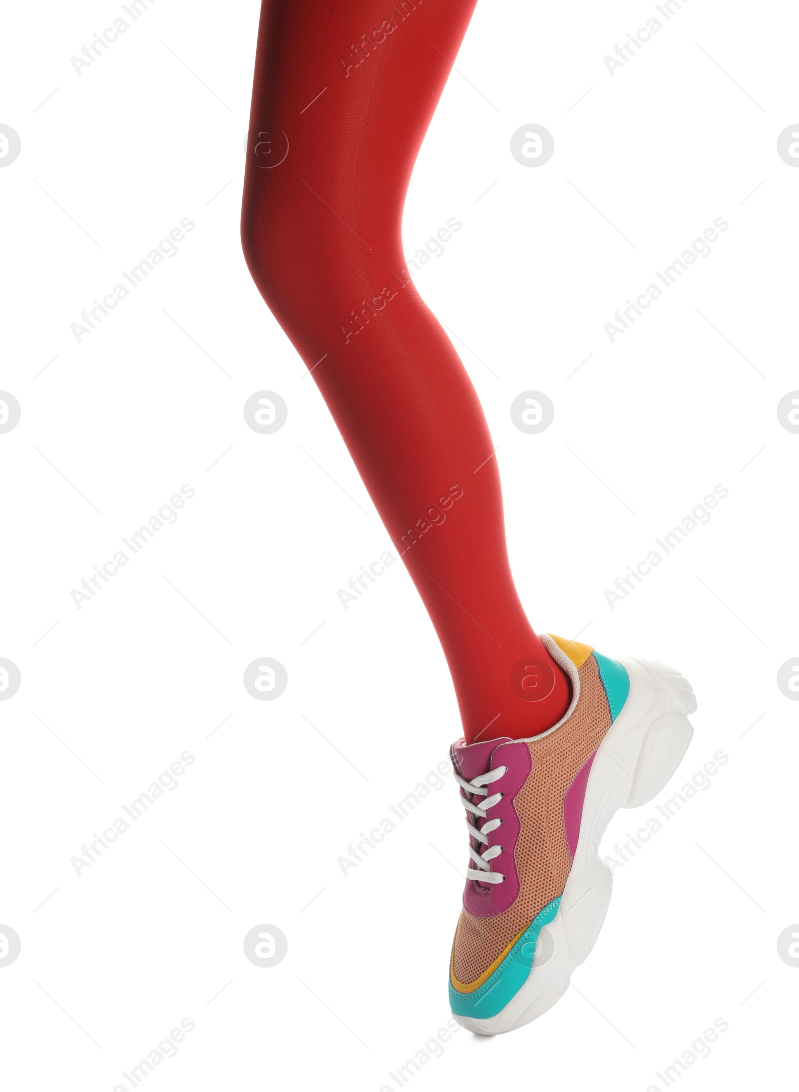 Photo of Woman wearing sneakers on white background, closeup