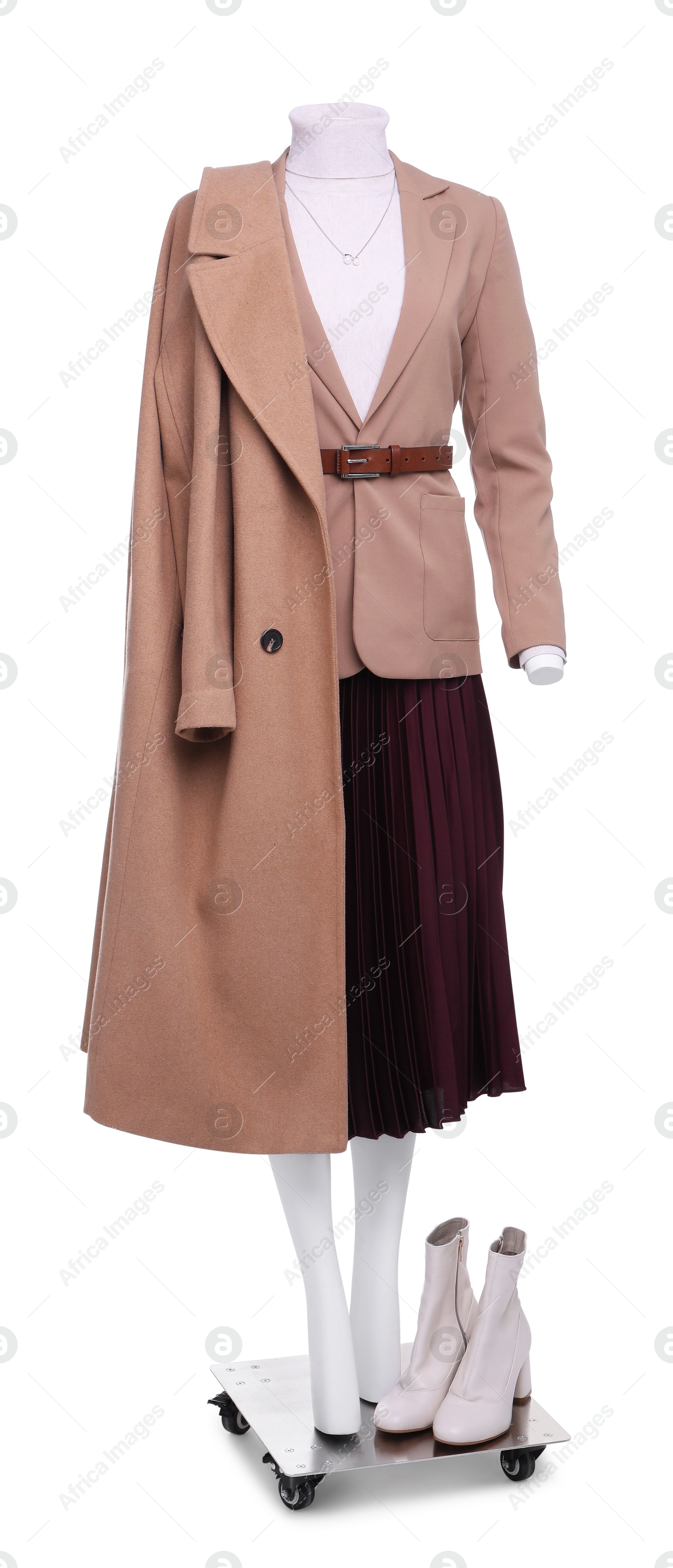 Photo of Female mannequin dressed in jacket, turtleneck, skirt and trench coat with accessories isolated on white. Stylish outfit