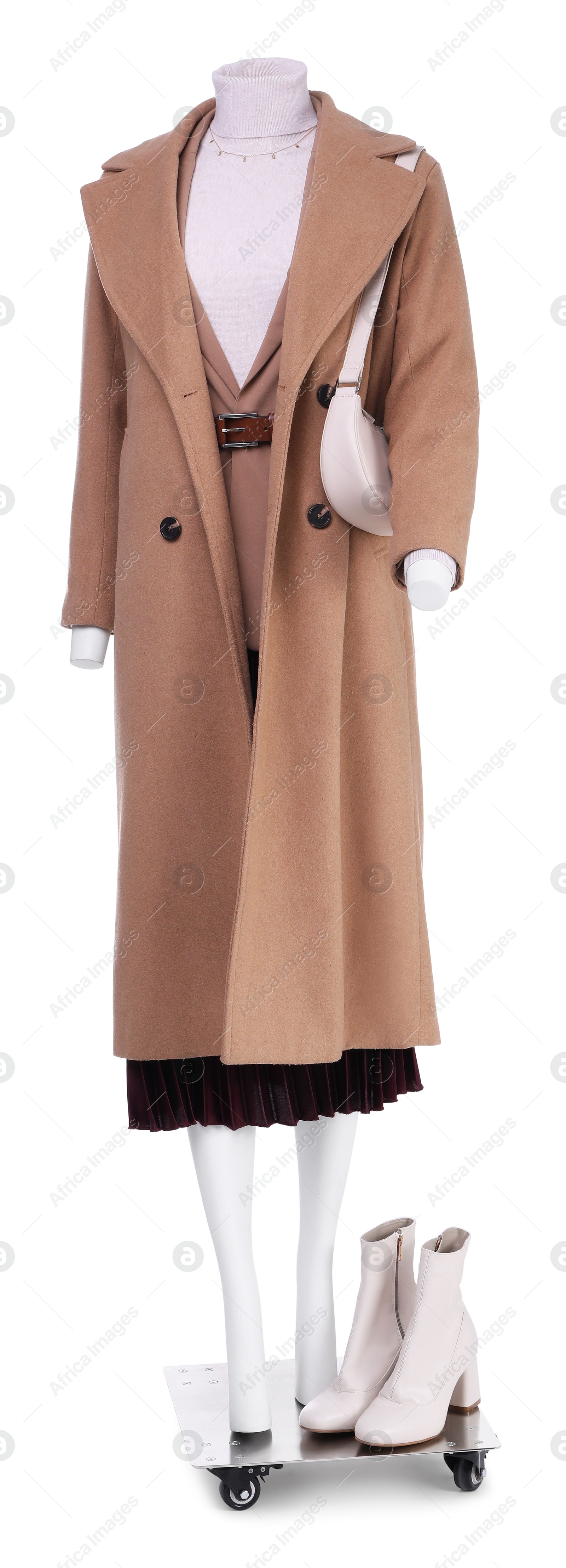 Photo of Female mannequin dressed in jacket, skirt and trench coat with accessories isolated on white. Stylish outfit