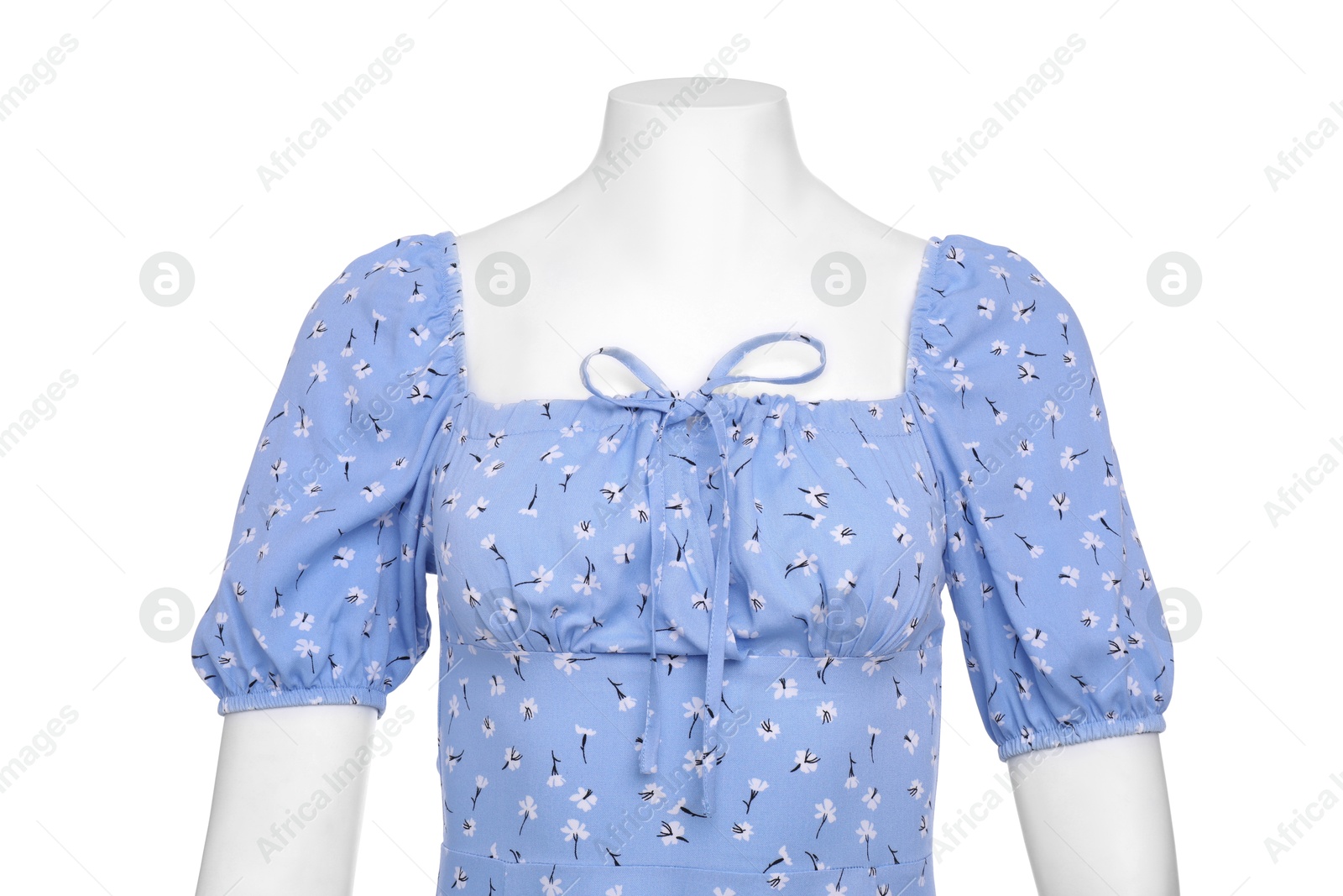 Photo of Female mannequin with necklace dressed in stylish light blue dress isolated on white