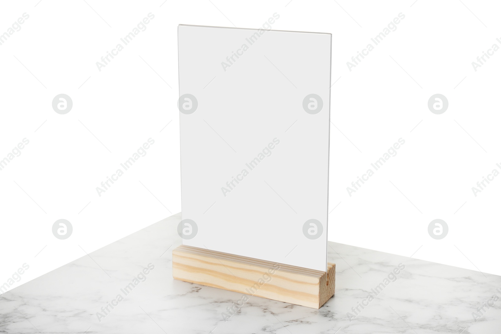 Photo of Menu holder on marble table against white background. Mockup for design