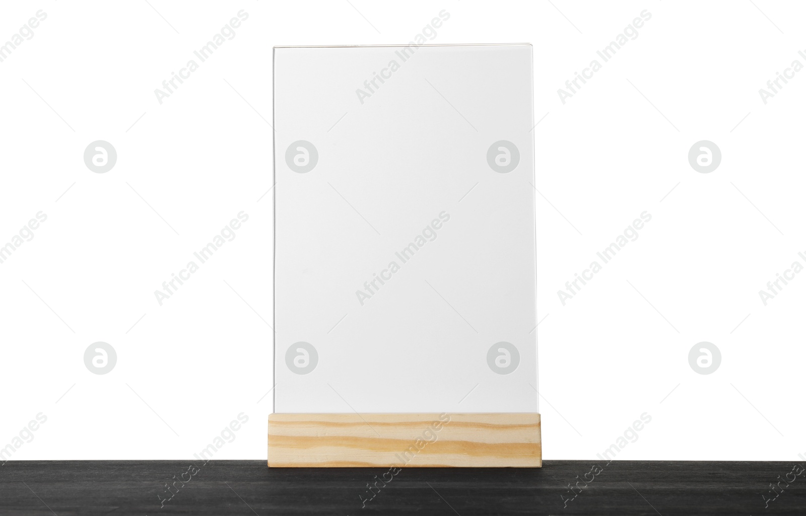 Photo of Menu holder on black wooden table against white background. Mockup for design