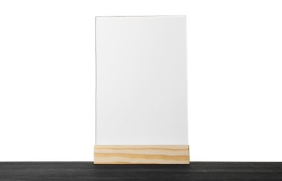 Photo of Menu holder on black wooden table against white background. Mockup for design