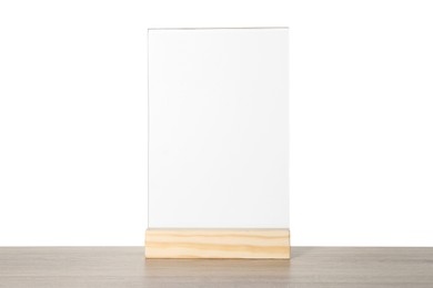 Photo of Menu holder on wooden table against white background. Mockup for design