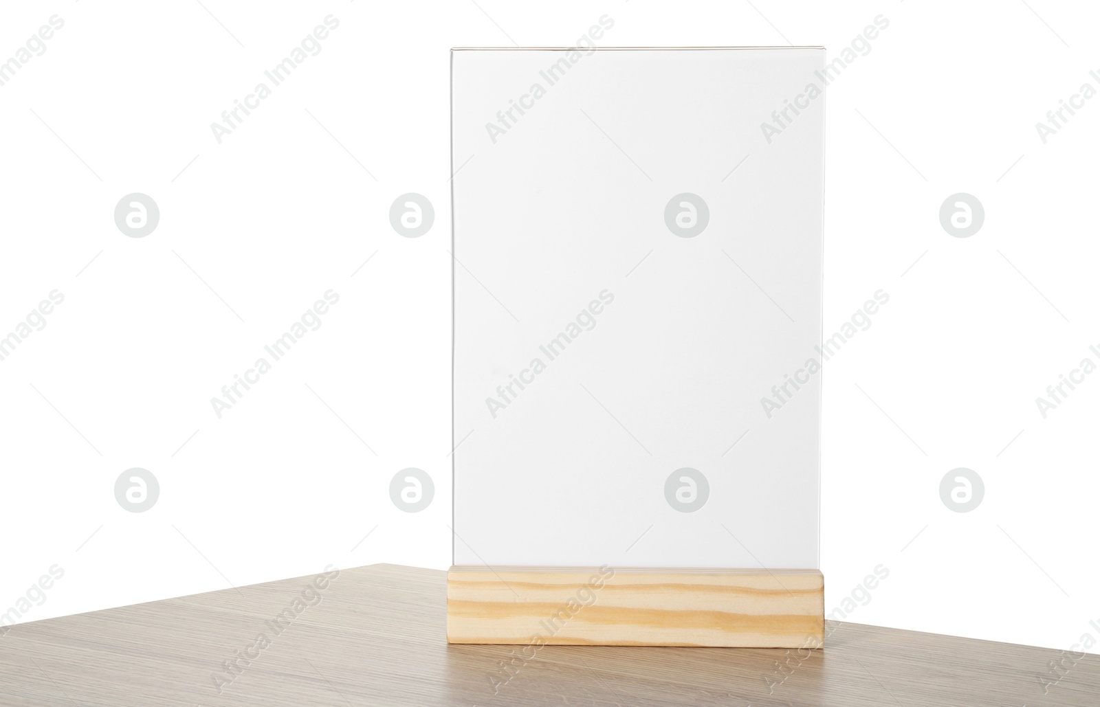 Photo of Menu holder on wooden table against white background. Mockup for design