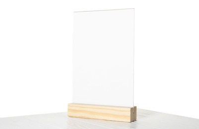 Photo of Menu holder on wooden table against white background. Mockup for design