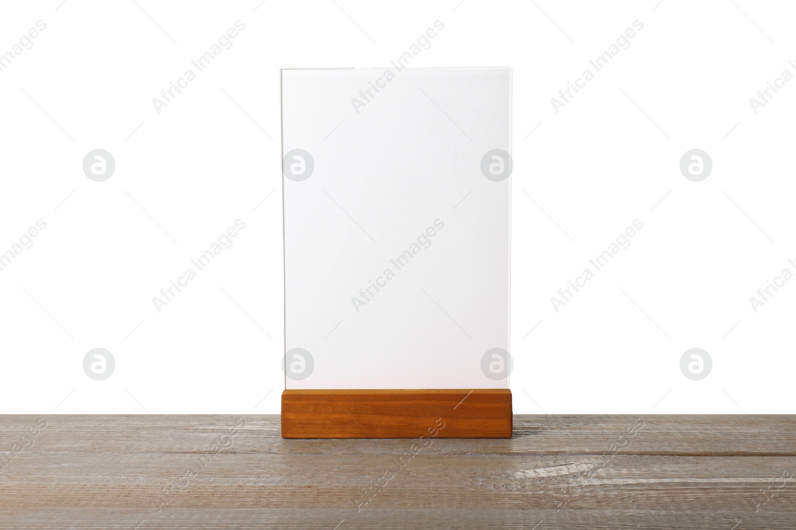 Photo of Menu holder on wooden table against white background. Mockup for design