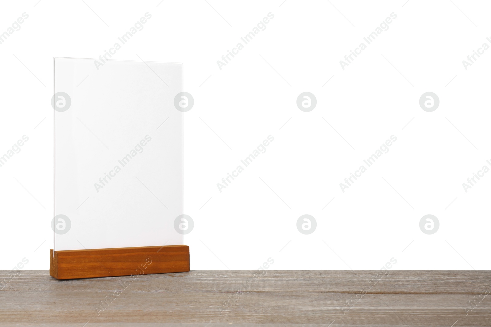 Photo of Menu holder on wooden table against white background. Mockup for design