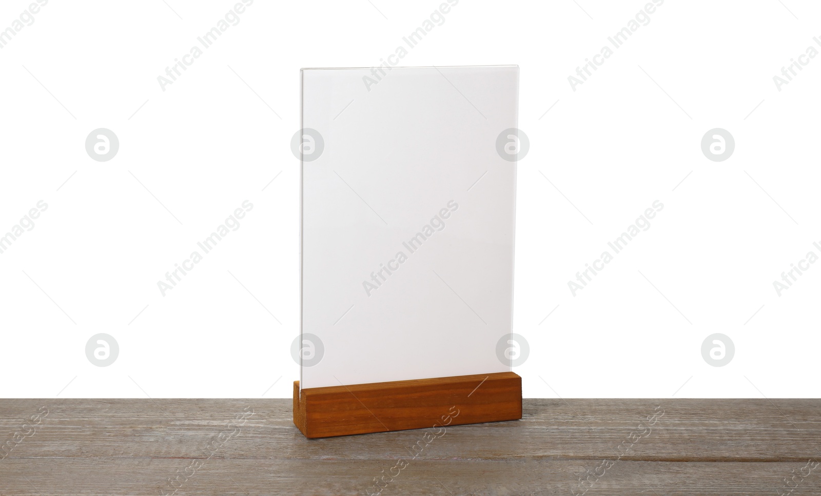 Photo of Menu holder on wooden table against white background. Mockup for design