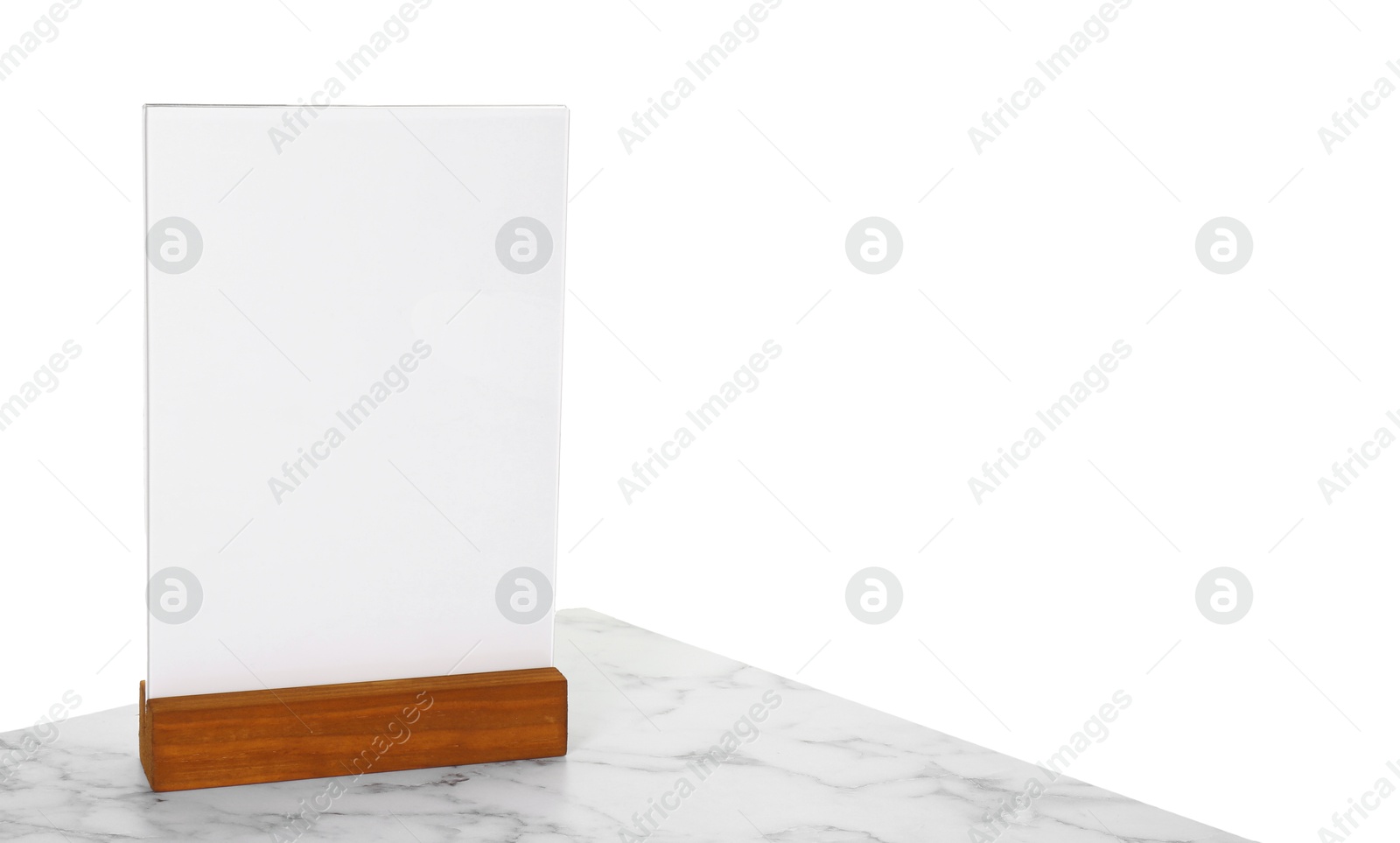 Photo of Menu holder on light marble table against white background. Space for text