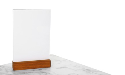 Photo of Menu holder on light marble table against white background. Space for text