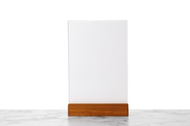 Photo of Menu holder on light marble table against white background. Mockup for design