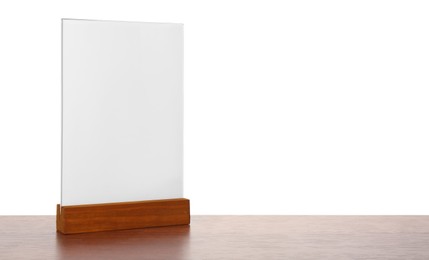 Photo of Menu holder on wooden table against white background. Mockup for design