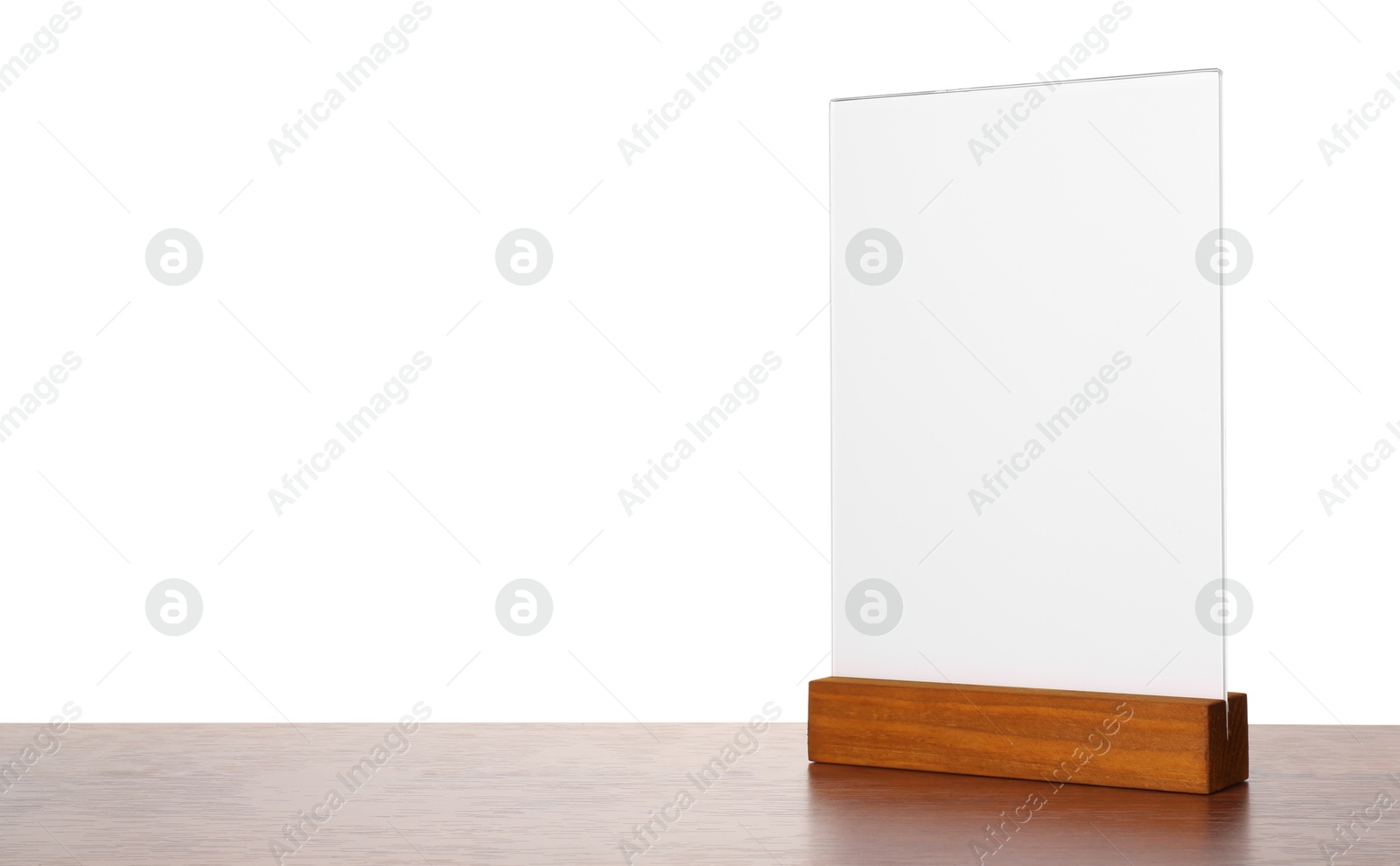 Photo of Menu holder on wooden table against white background. Mockup for design