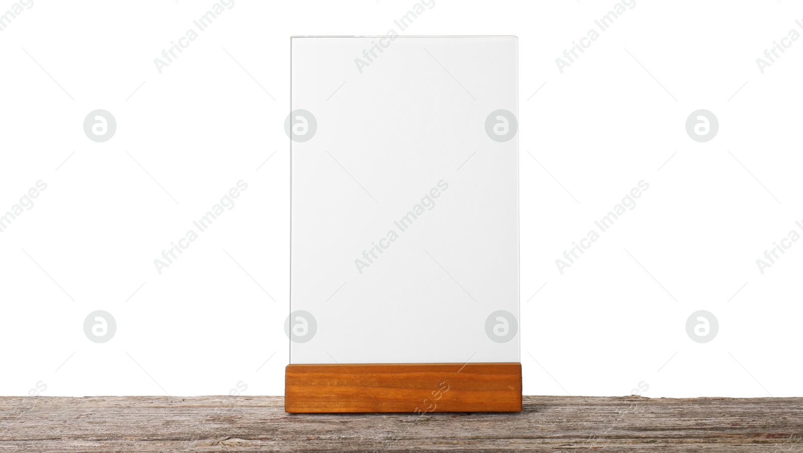 Photo of Menu holder on wooden table against white background. Mockup for design