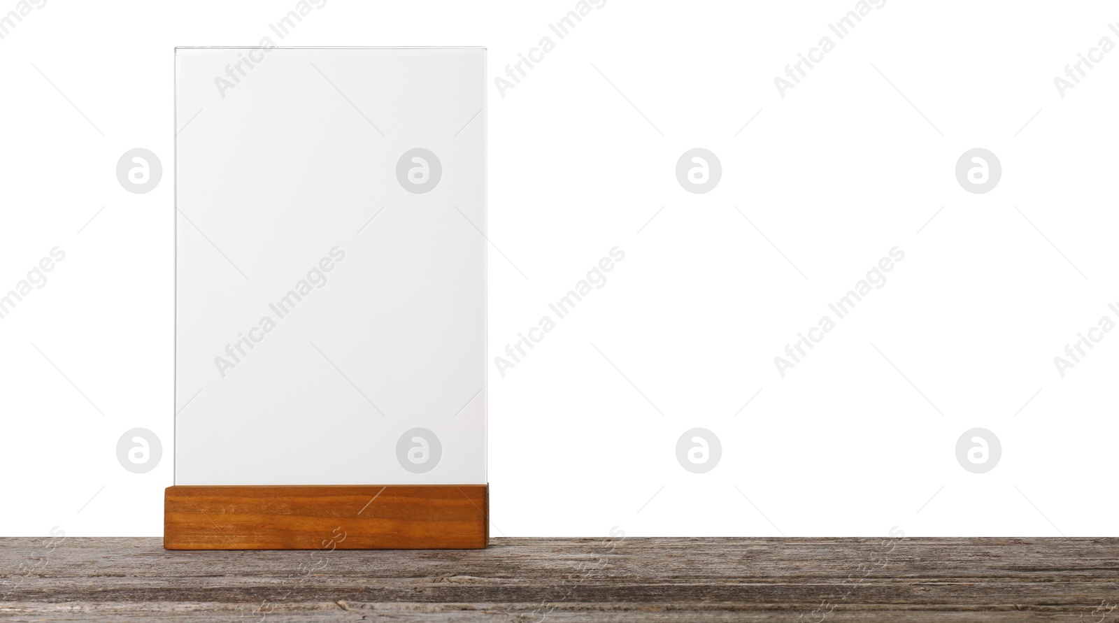 Photo of Menu holder on wooden table against white background. Mockup for design