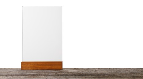 Photo of Menu holder on wooden table against white background. Mockup for design