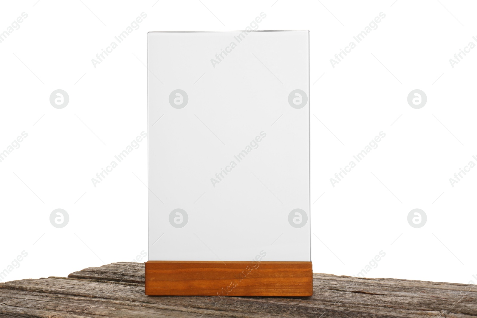 Photo of Menu holder on wooden table against white background. Mockup for design