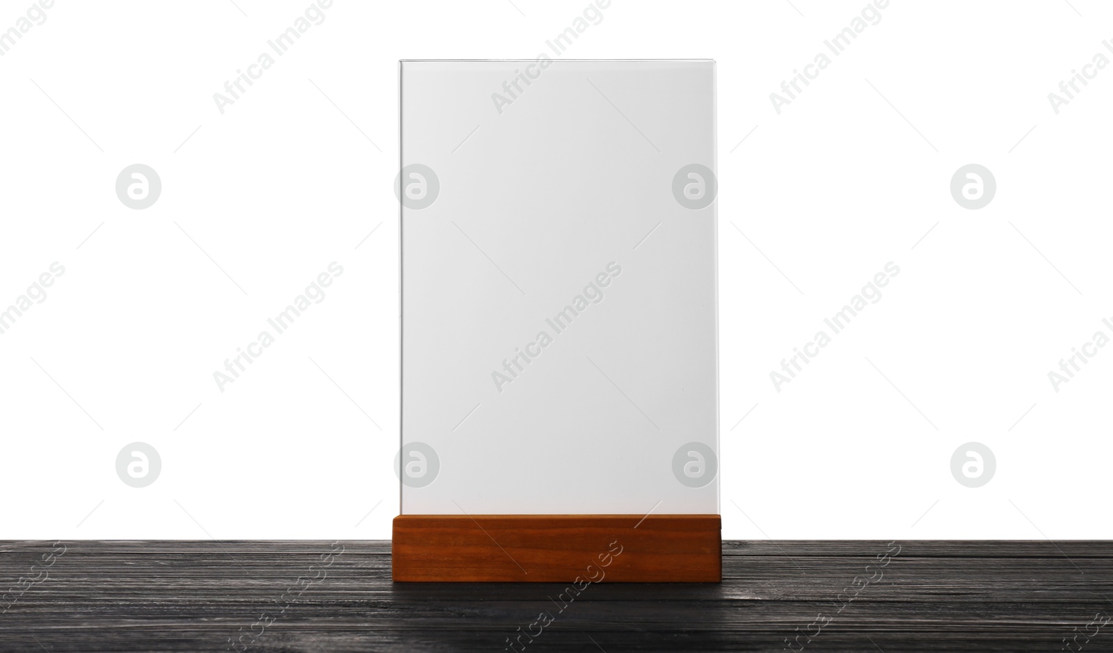 Photo of Menu holder on wooden table against white background. Mockup for design