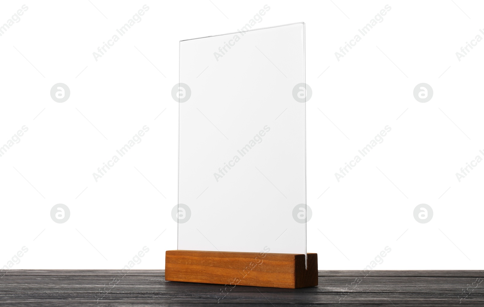 Photo of Menu holder on wooden table against white background. Mockup for design