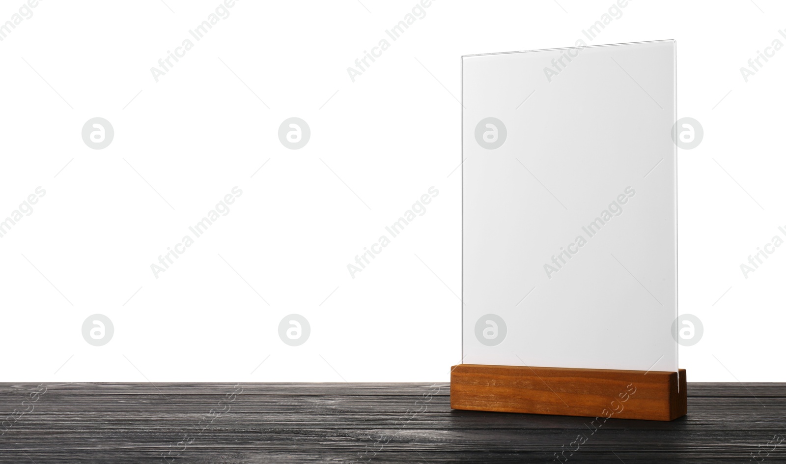 Photo of Menu holder on wooden table against white background. Mockup for design