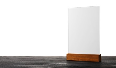 Photo of Menu holder on wooden table against white background. Mockup for design