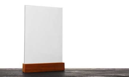 Photo of Menu holder on wooden table against white background. Mockup for design