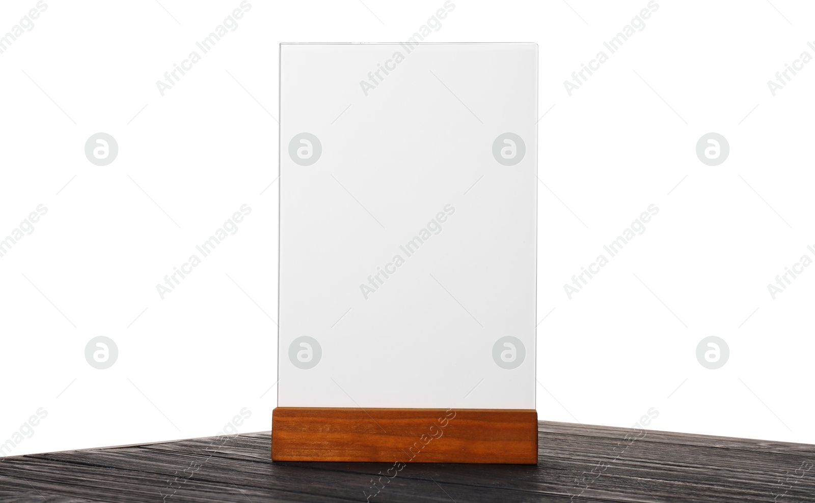 Photo of Menu holder on wooden table against white background. Mockup for design