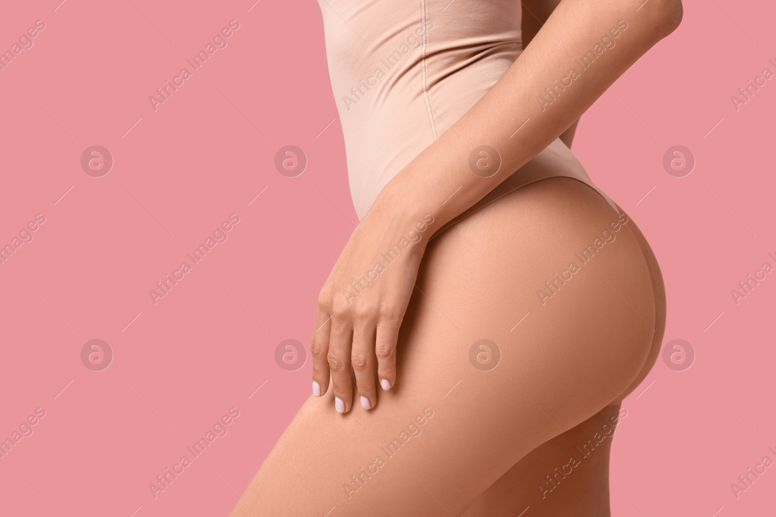 Photo of Beautiful woman with perfect skin on pink background, closeup. Body care