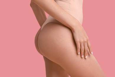 Photo of Beautiful woman with perfect skin on pink background, closeup. Body care