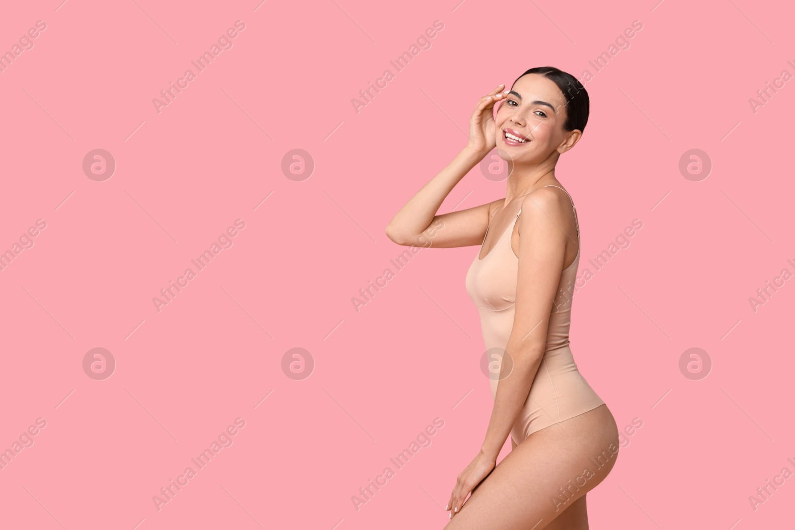 Photo of Smiling woman with perfect skin on pink background, space for text. Body care