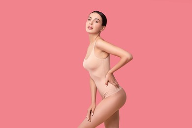 Photo of Beautiful woman with perfect skin on pink background. Body care