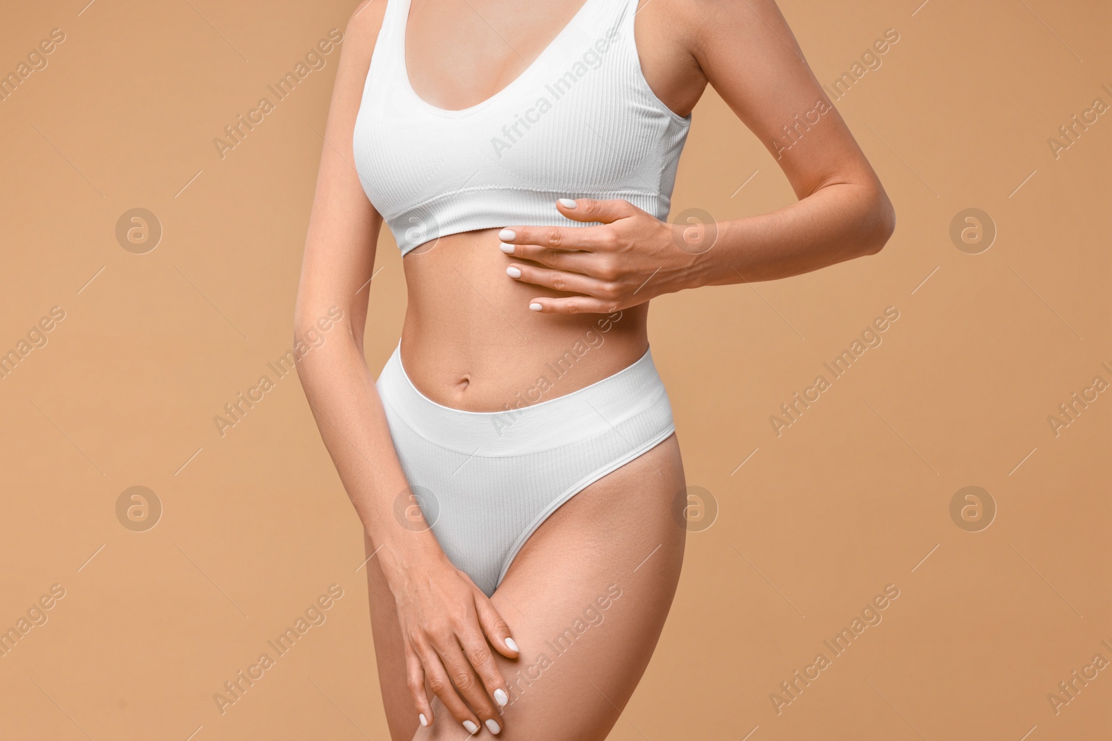 Photo of Woman with perfect skin on beige background, closeup. Body care