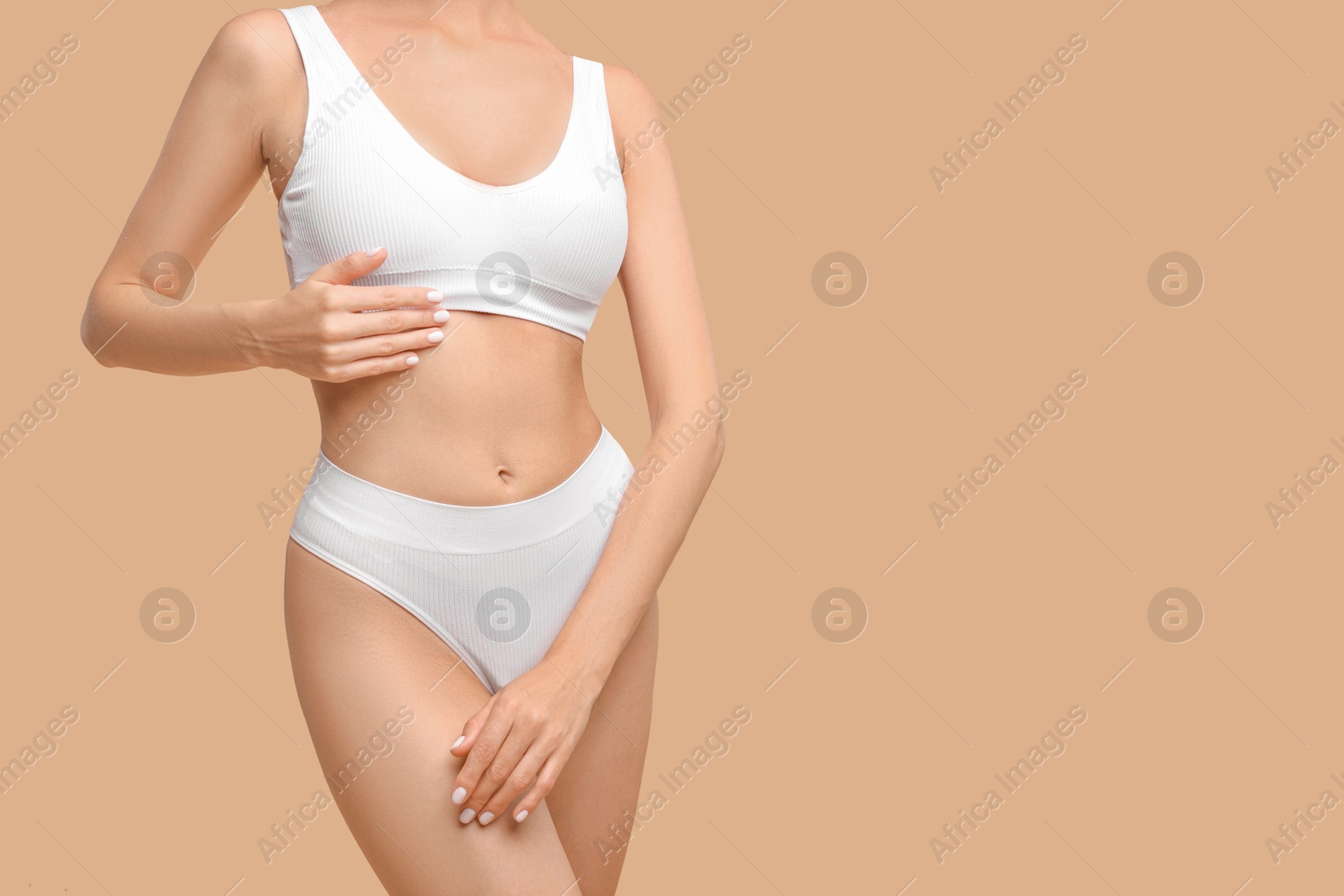 Photo of Woman with perfect skin on beige background, closeup and space for text. Body care