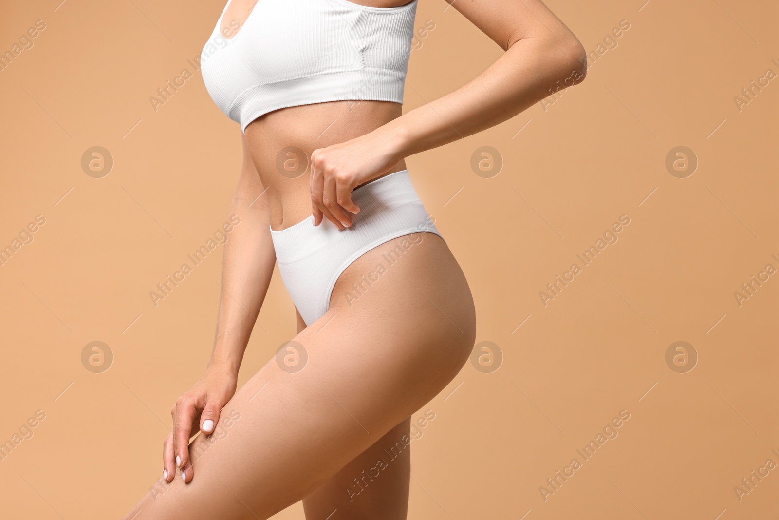 Photo of Woman with perfect skin on beige background, closeup. Body care