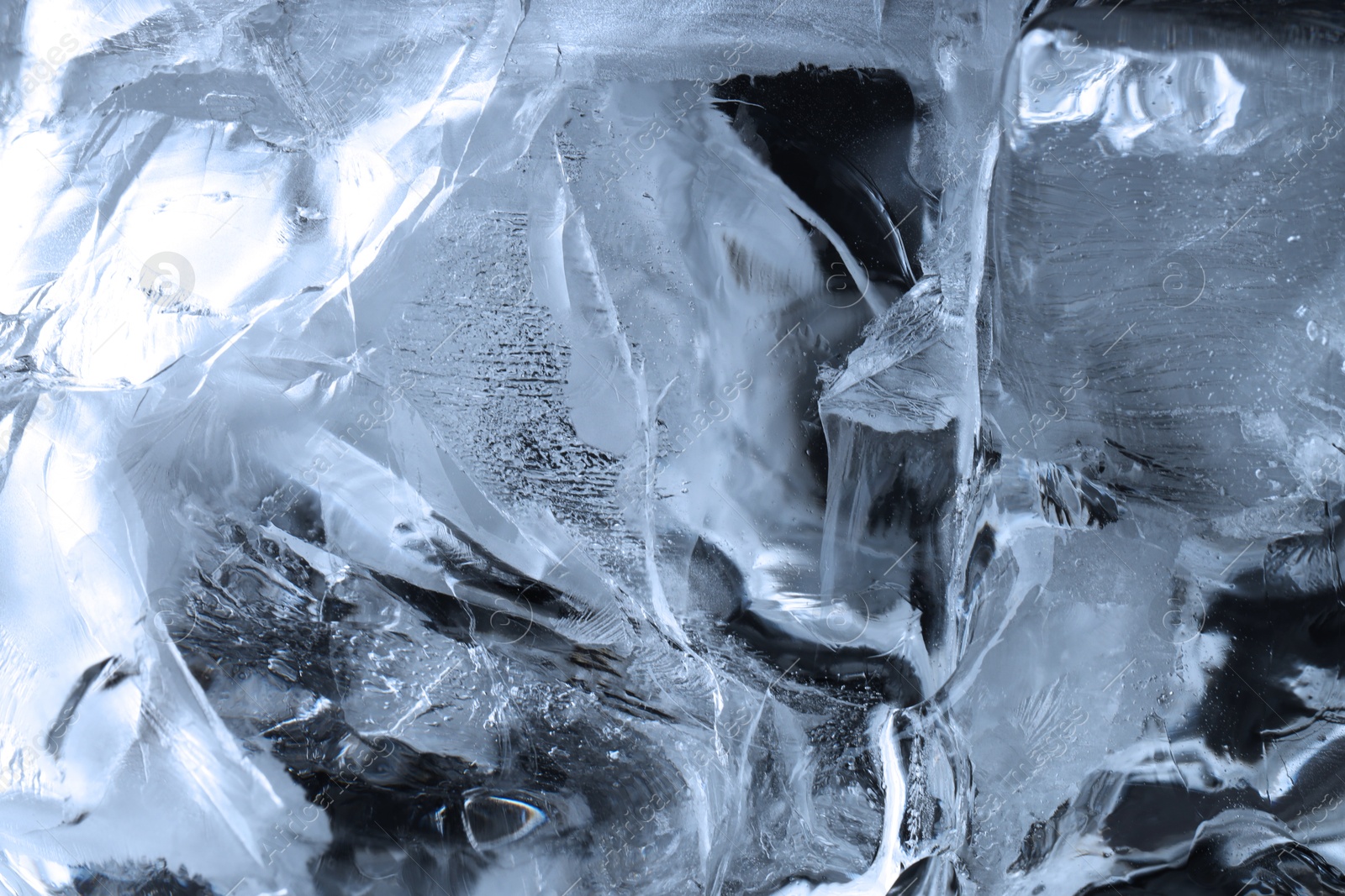 Photo of Beautiful clear ice as background, closeup view