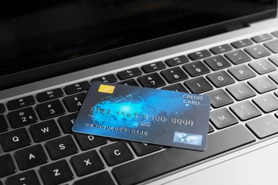 One plastic credit card on modern laptop