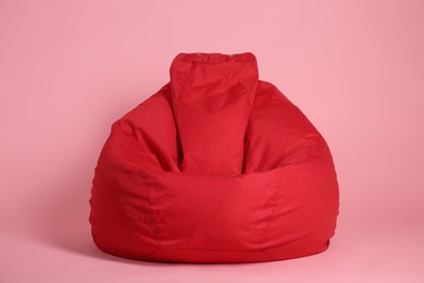 Photo of Red bean bag chair on pink background