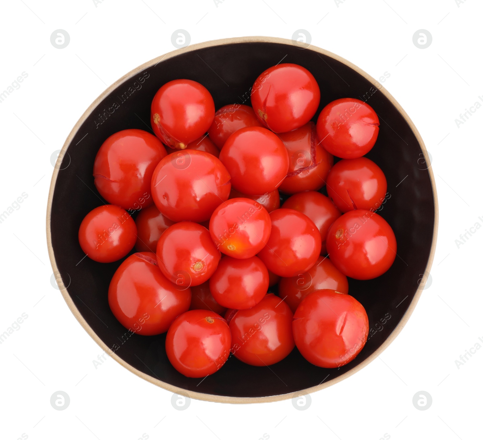 Photo of Tasty pickled tomatoes in bowl isolated on white, top view