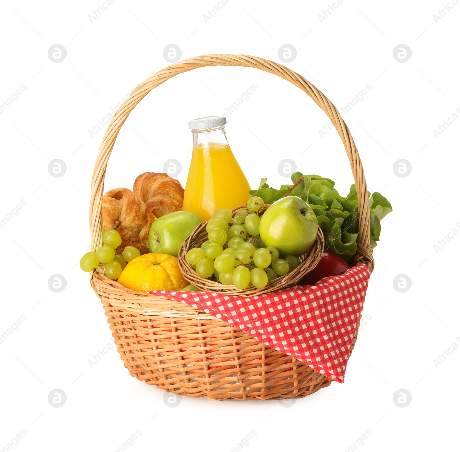 Photo of Picnic wicker basket with checkered napkin, food and juice isolated on white