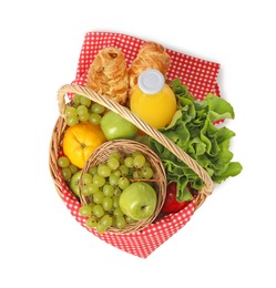 Photo of Picnic basket with checkered napkin, food and juice isolated on white, top view