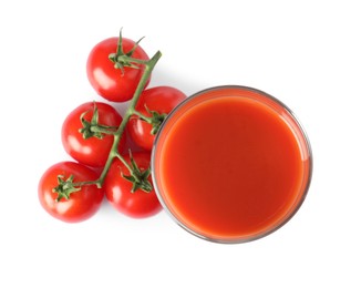 Tasty tomato juice in glass and fresh vegetables isolated on white, top view