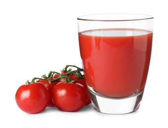 Tasty tomato juice in glass and fresh vegetables isolated on white