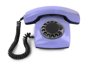 Photo of One violet telephone with handset isolated on white