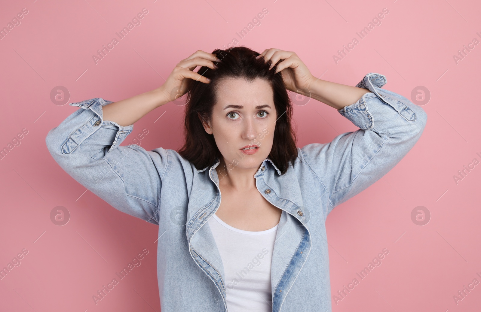 Photo of Woman with hair loss problem on pink background