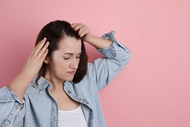 Photo of Woman with hair loss problem on pink background