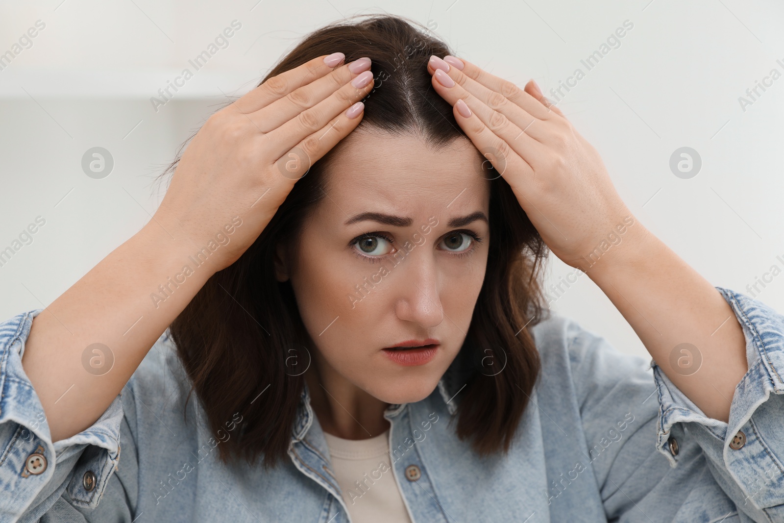 Photo of Woman with hair loss problem at home