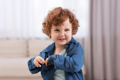 Portrait of little boy indoors. Cute child