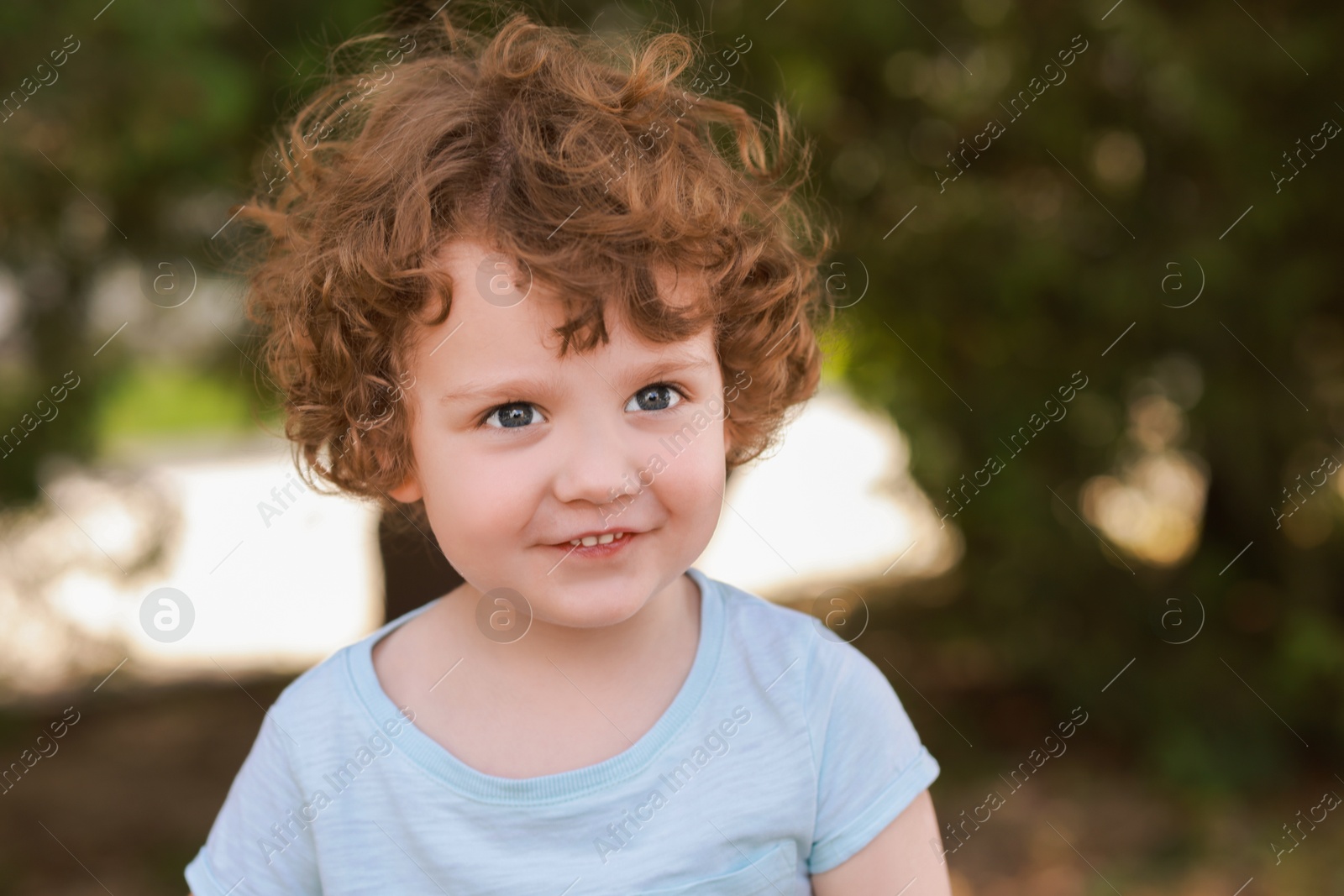 Photo of Portrait of little boy outdoors. Cute child