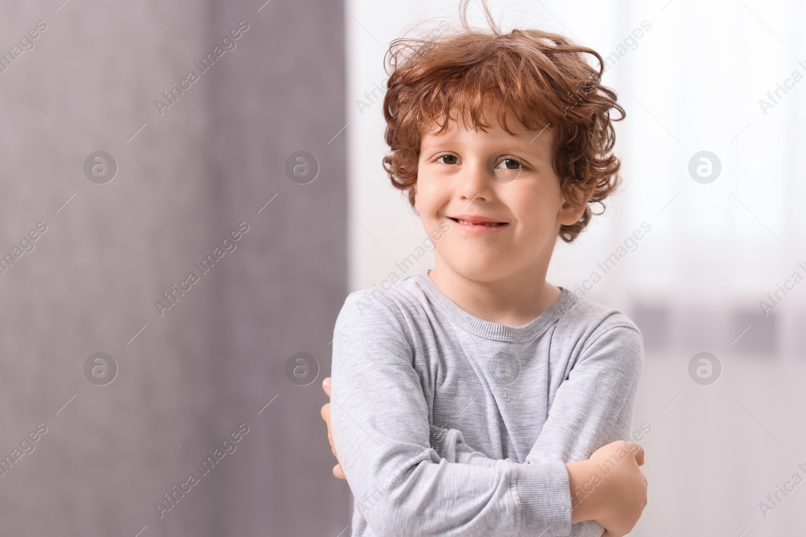 Photo of Portrait of little boy indoors, space for text. Cute child